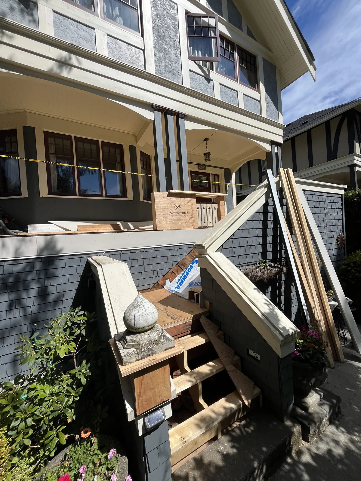 Exterior stairs and deck framing on the side of a house