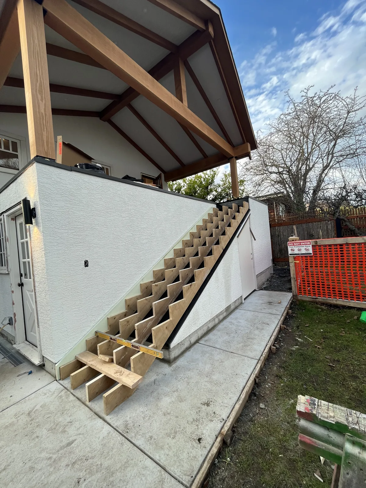 Concrete retaining wall with timber framing above