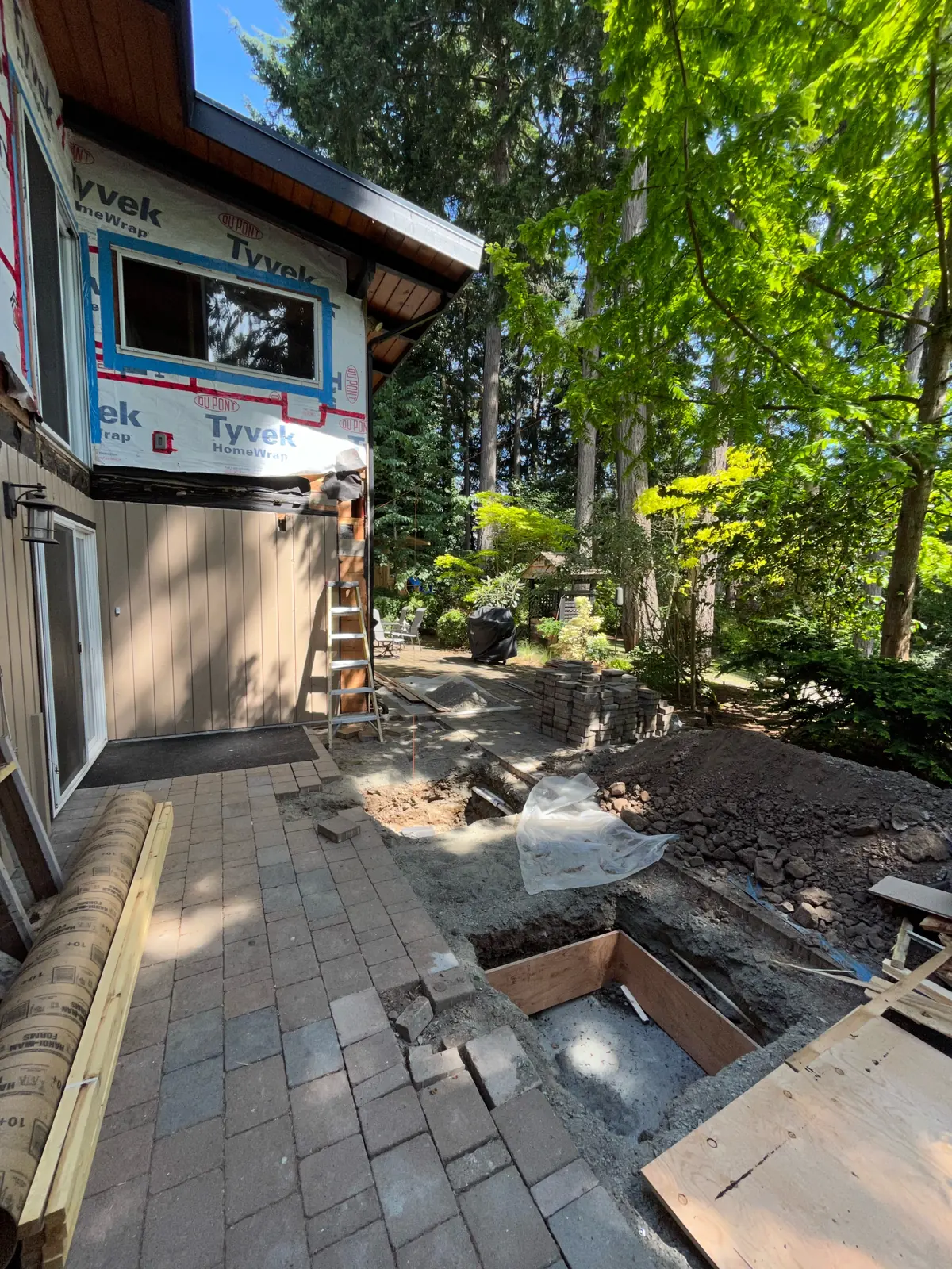 Paving stones and excavation alongside a house