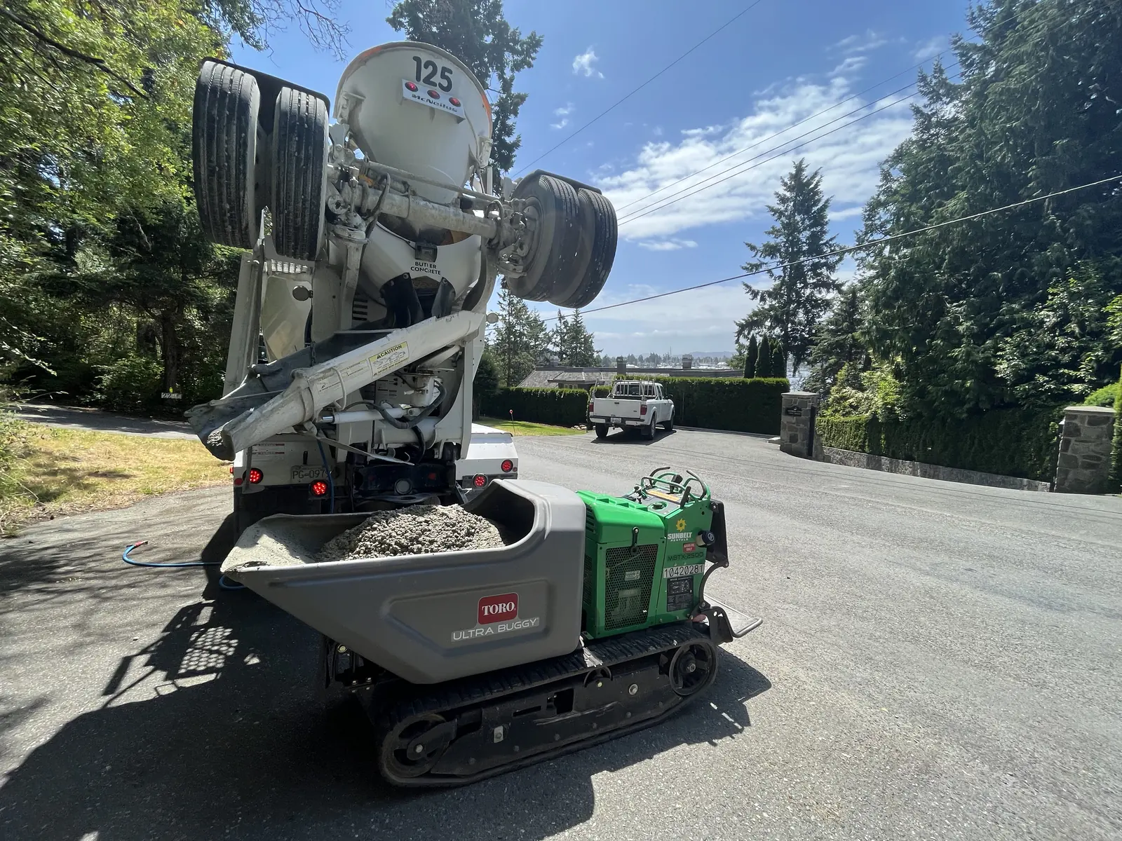 Tracked concrete buggy on a driveway