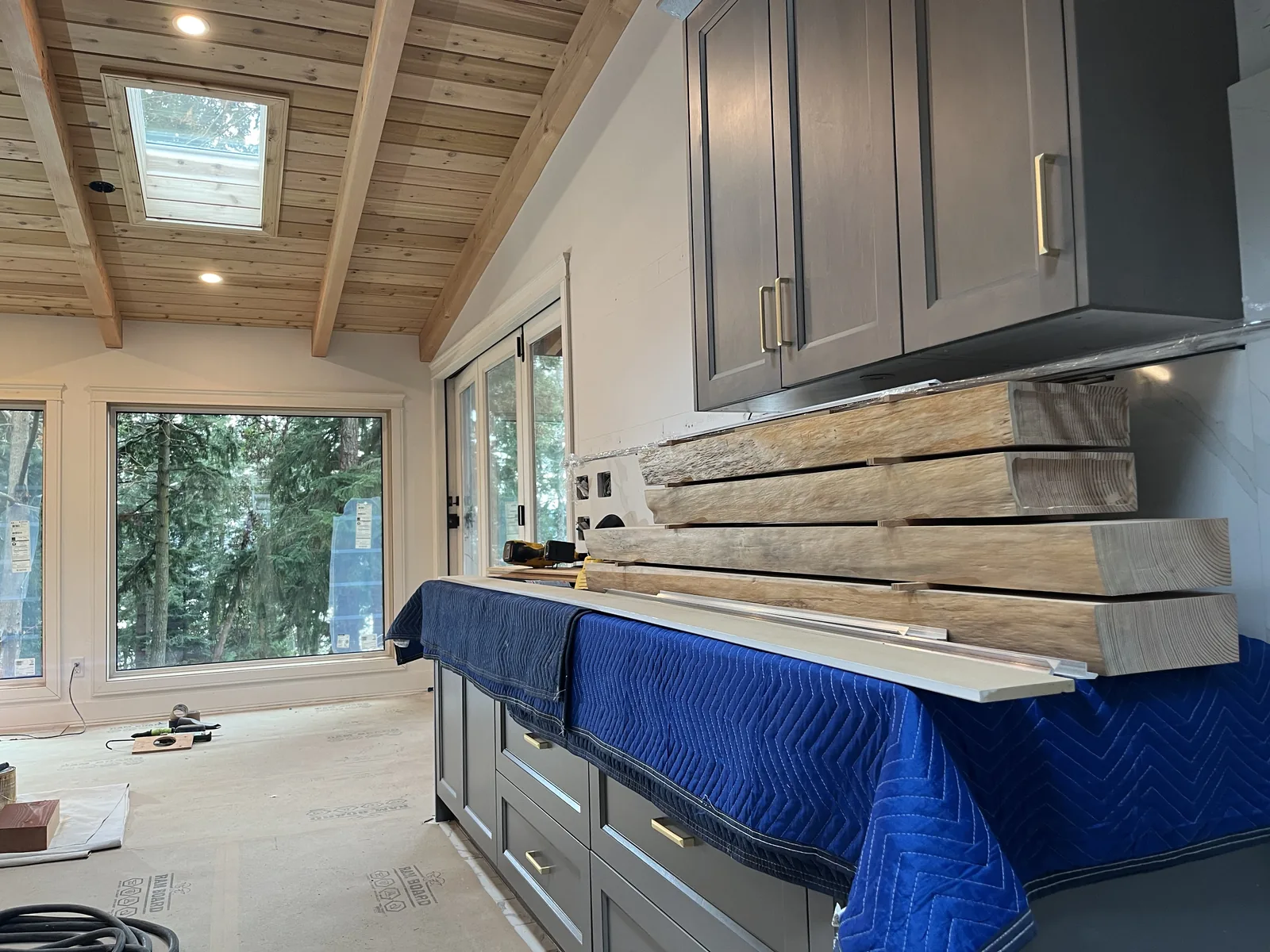 Kitchen cabinets covered and protected during construction