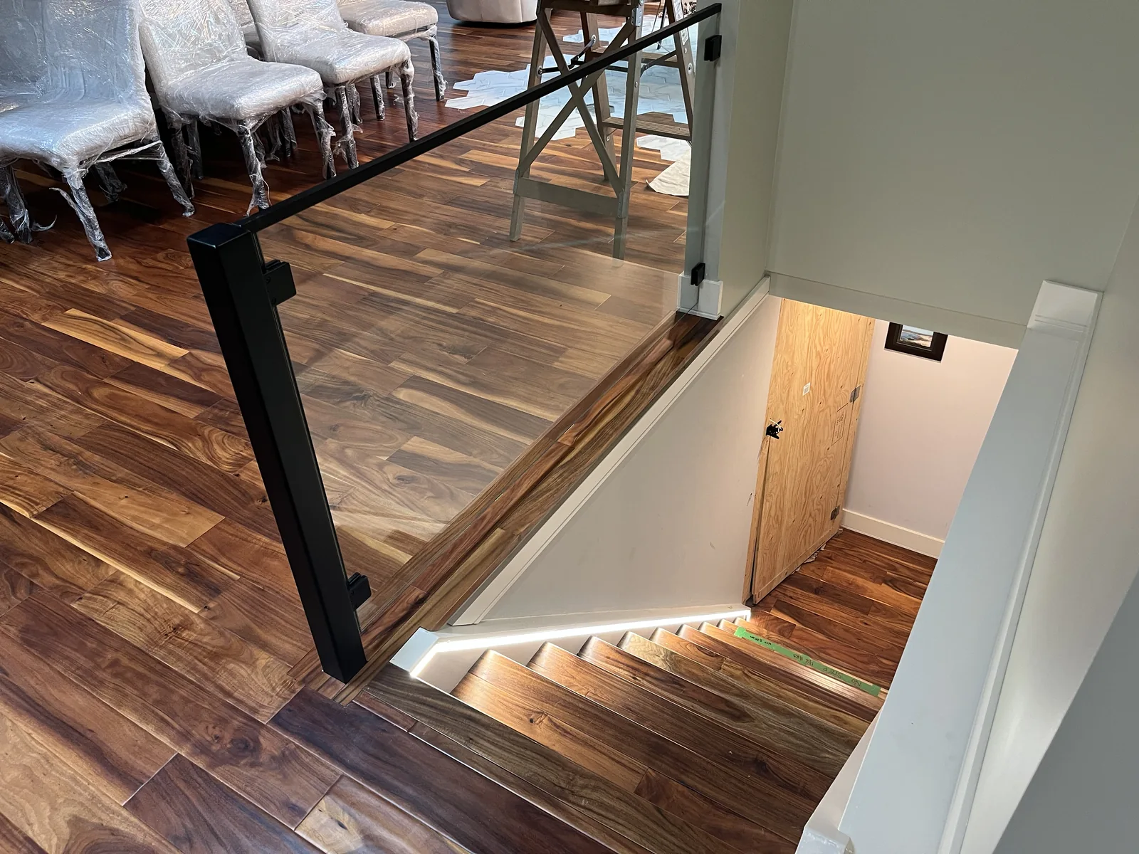 Hardwood flooring laid around a new stair opening