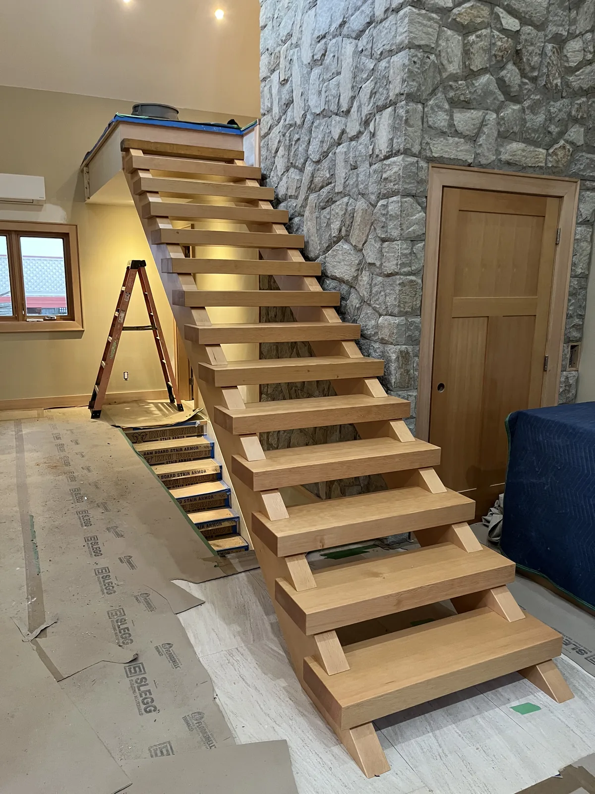 Wood stair treads being installed