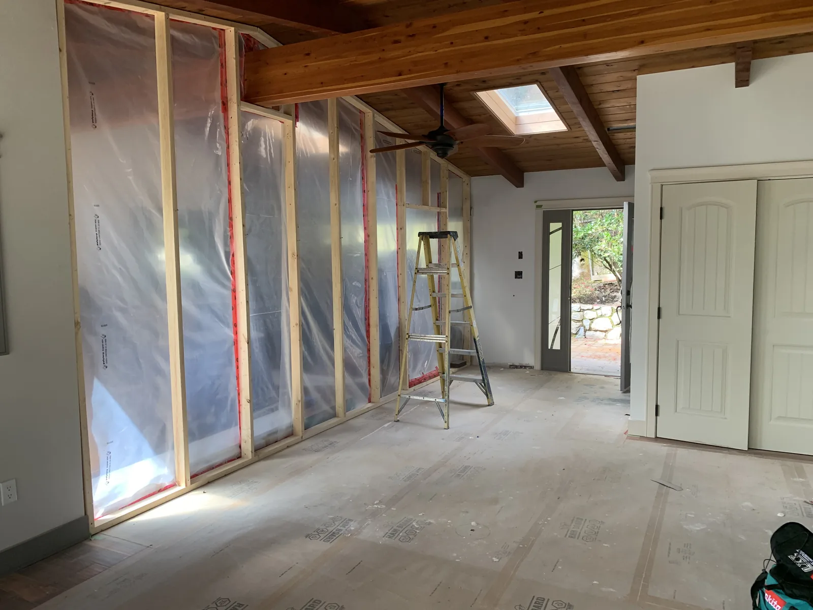 Interior partition framing with new windows beyond