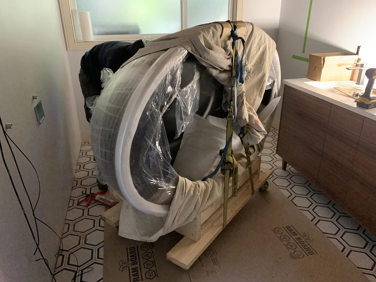 Bathtub wrapped and protected during finishing