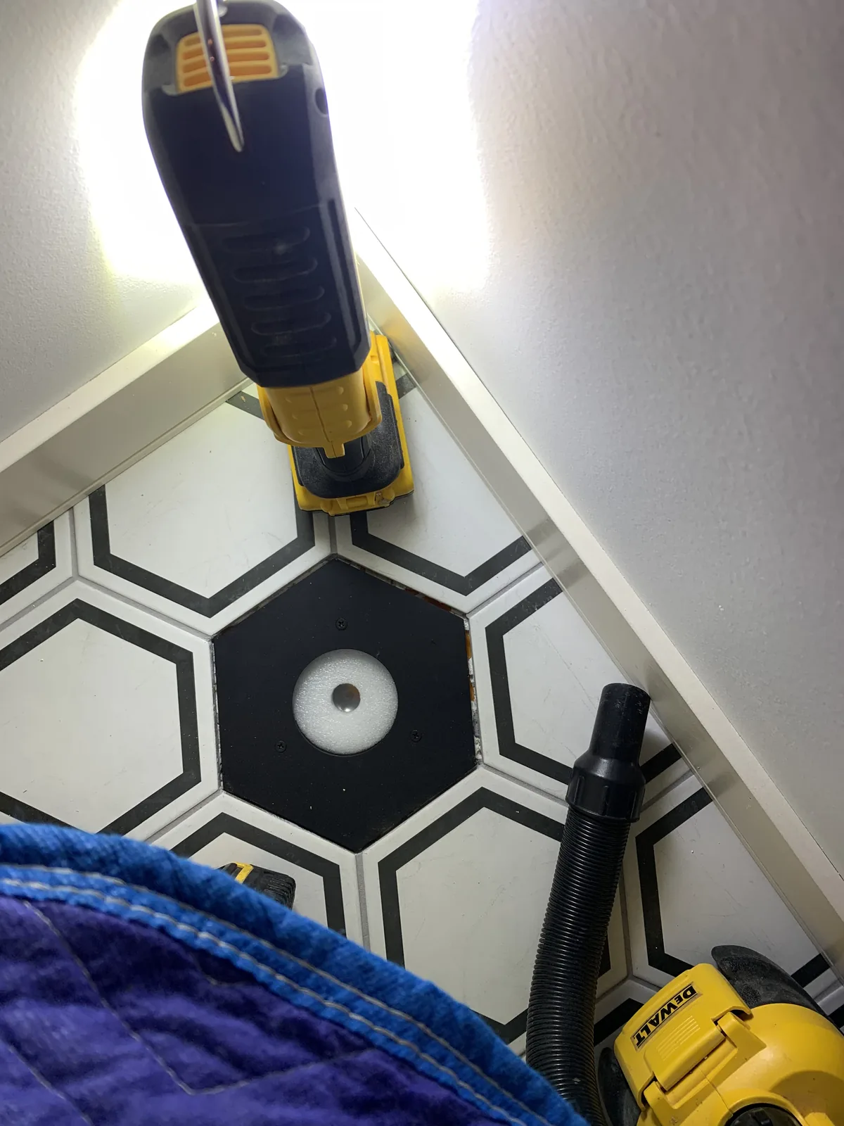 Hexagon tile floor with tools during installation