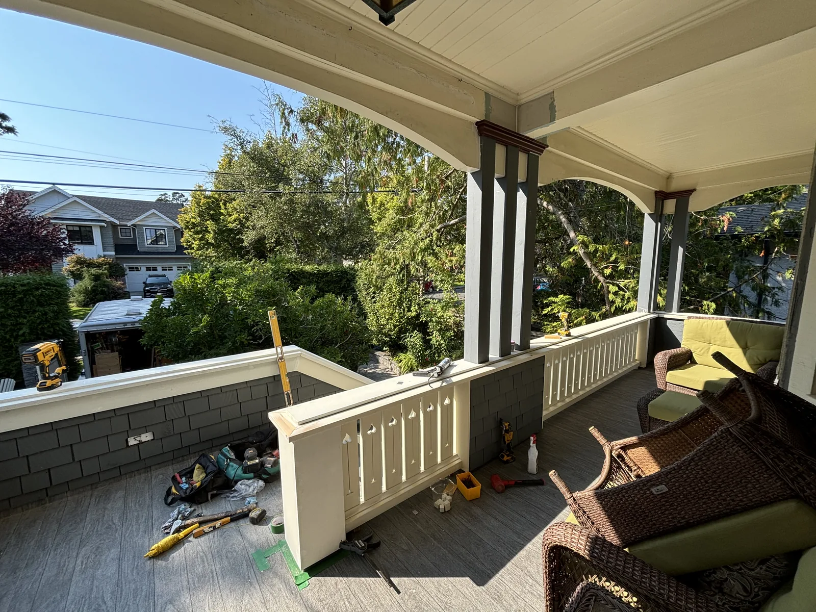 Covered deck with timber posts and railings under construction