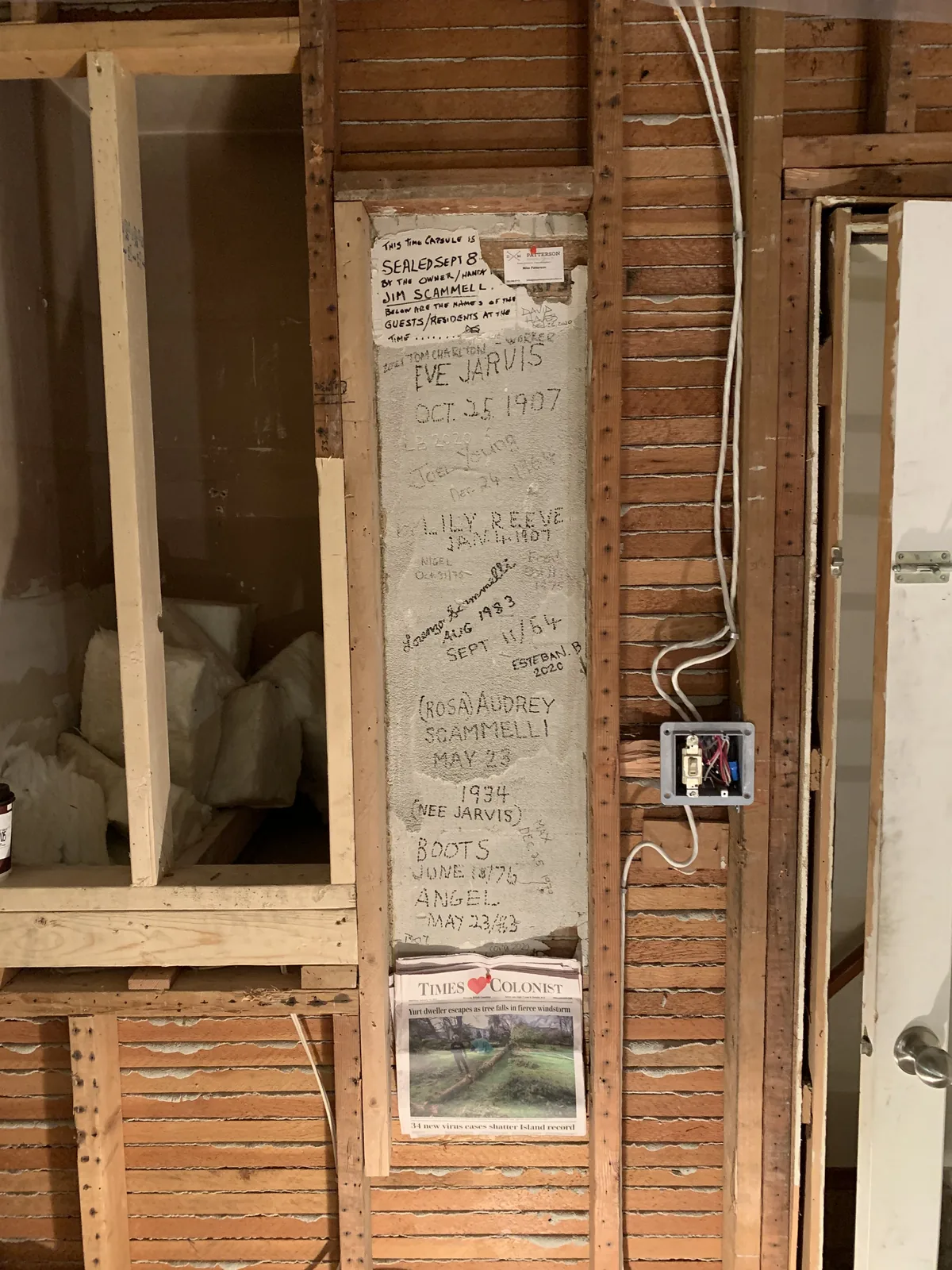 Wall opened to the studs with wiring exposed during a renovation