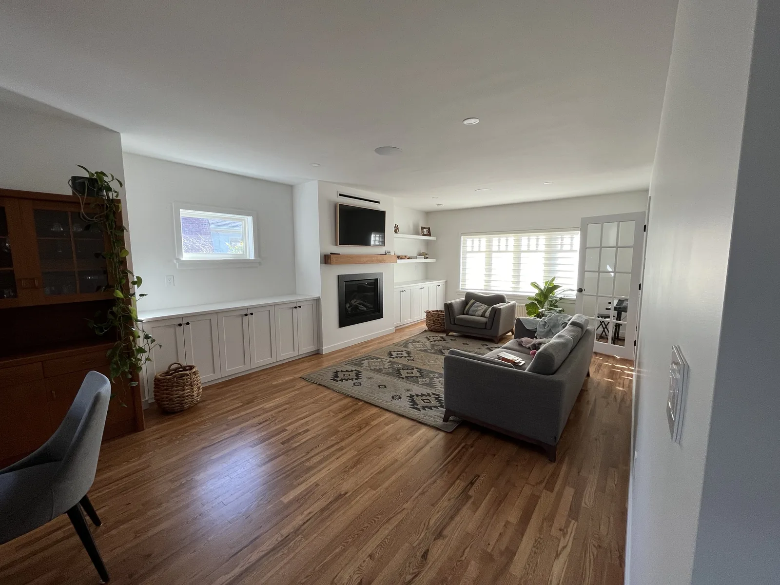 Open living area looking through to a renovated kitchen