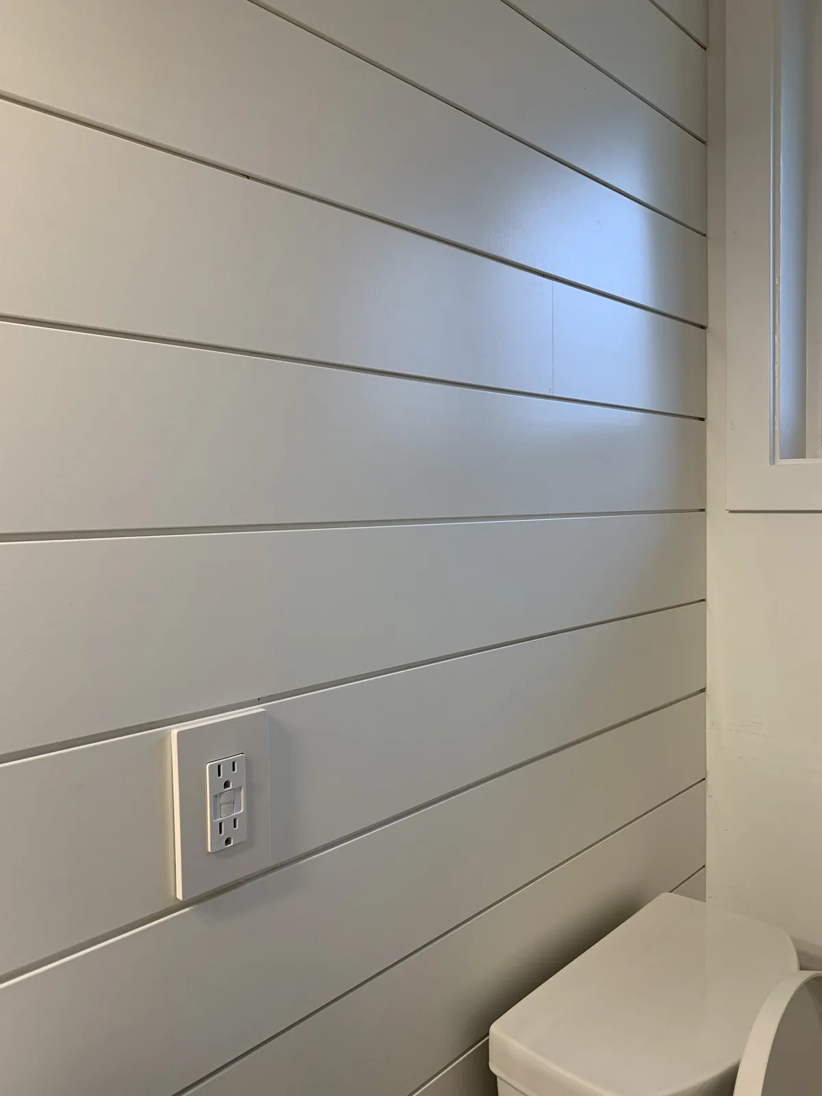 White shiplap wall in a finished room