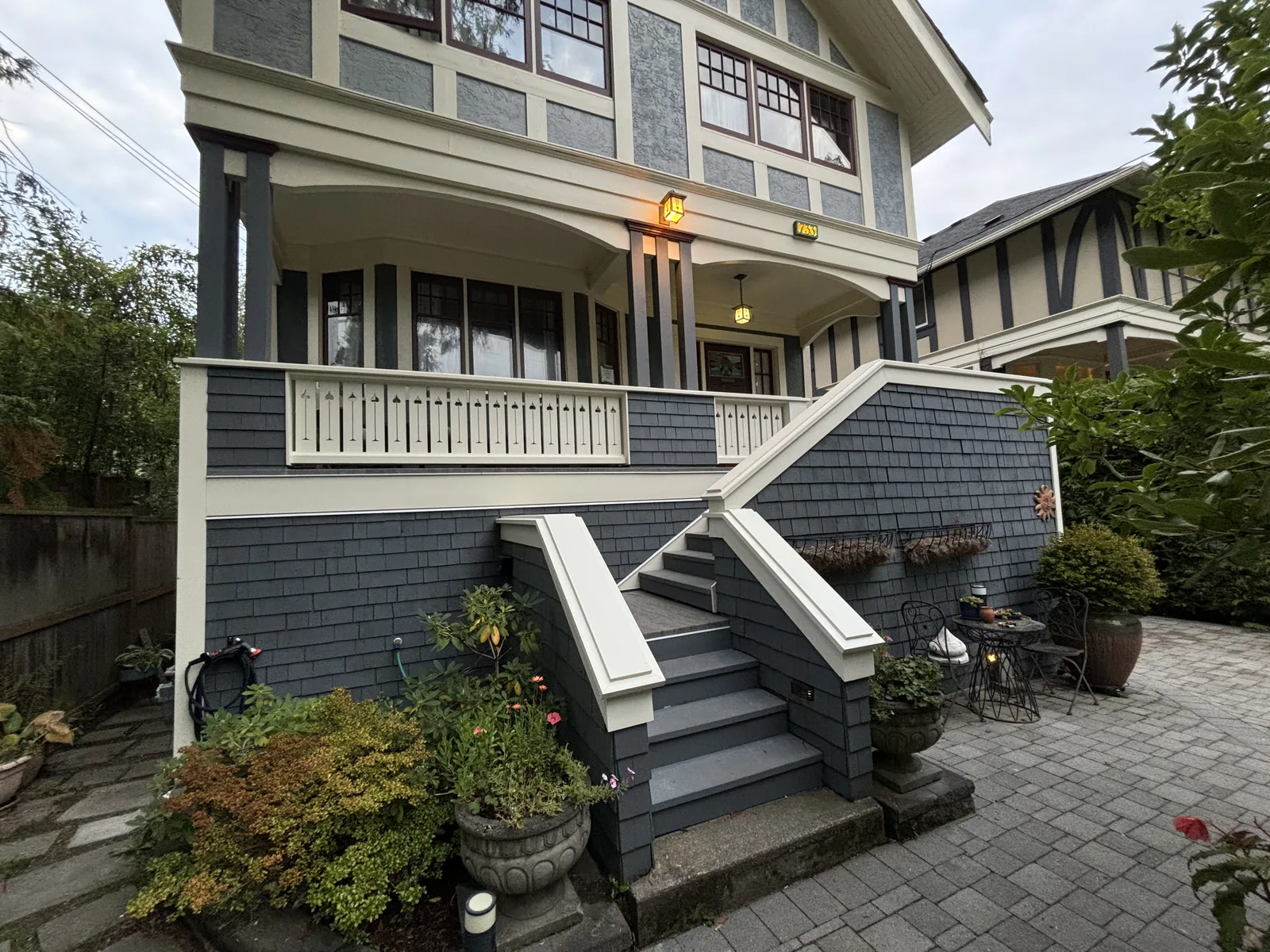 Character home exterior with rebuilt front stairs and landscaping