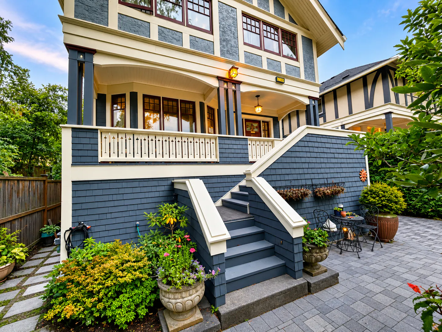 Character home exterior with blue shingle siding, a covered porch and rebuilt front steps, completed by DM Patterson Construction on Vancouver Island